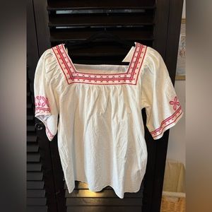 L love white top with pink and red embroidery. Square neckline